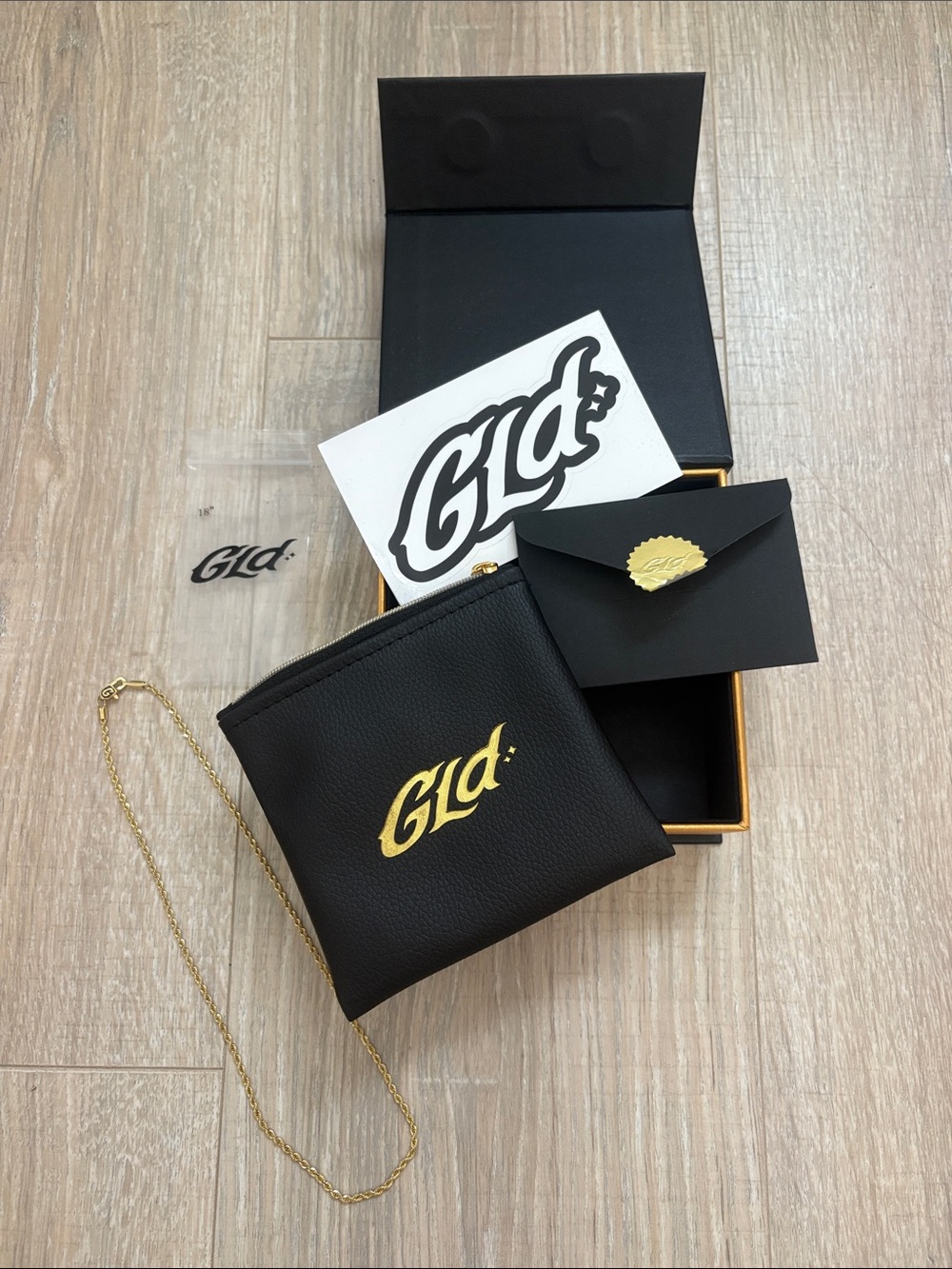 GLD Black Leather Chain Pouch with Gold Logo